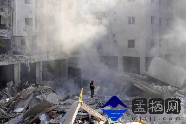 A man stands on the rubble of buildings near the site of the assassination of Hezbollah leader Hassan Nasrallah in Beirut