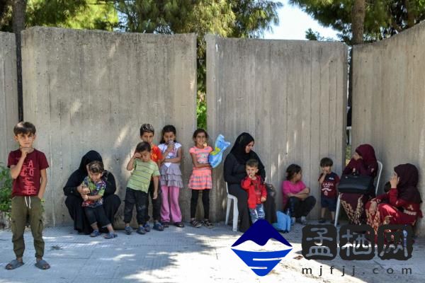 People displaced from their homes seek shelter in the northern city of Tripoli, Lebanon, on Wednesday.